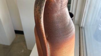 ceramic pitcher with orange gradient glaze